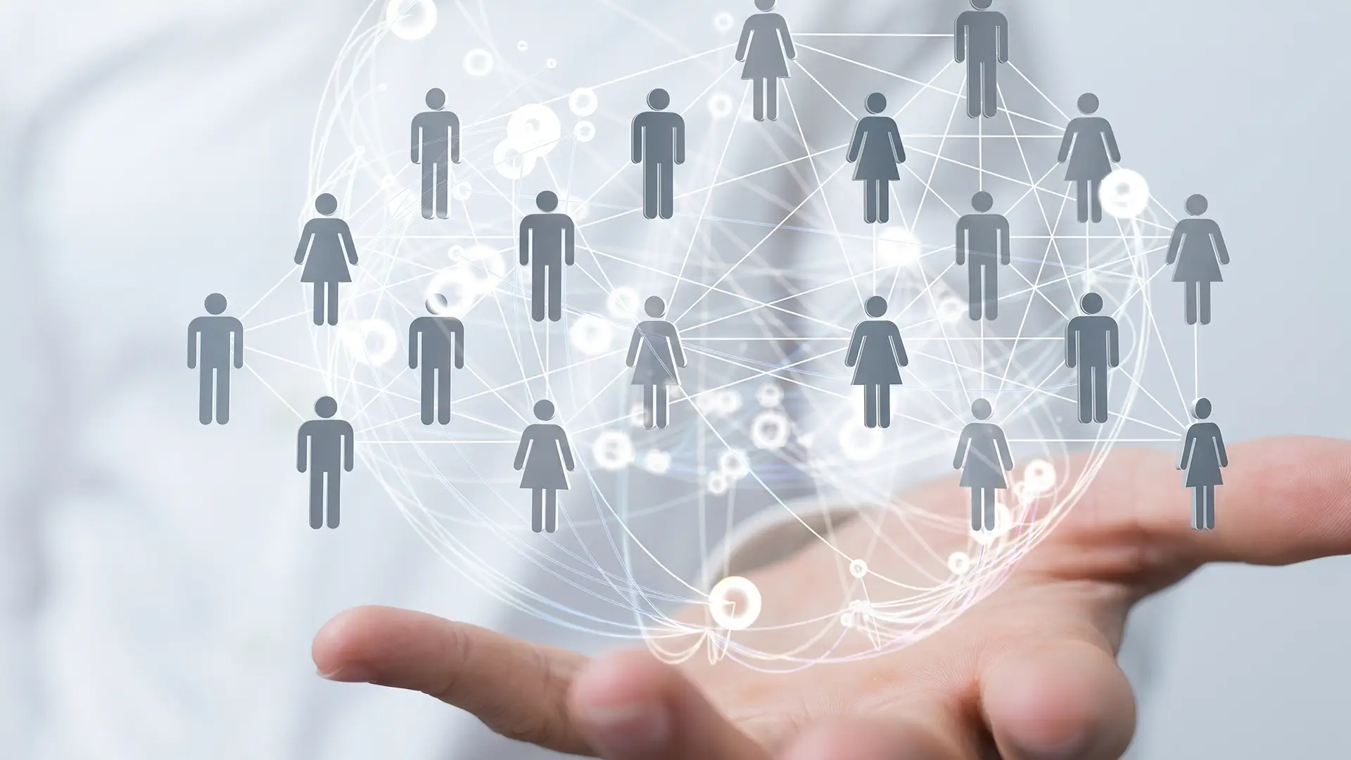 Ki-generiertes Bild - Symbolische Darstellung eines digitalen Netzwerks aus verbundenen Personen über einer Hand, zeigt Kommunikation und Vernetzung im Kontext von Pecos.